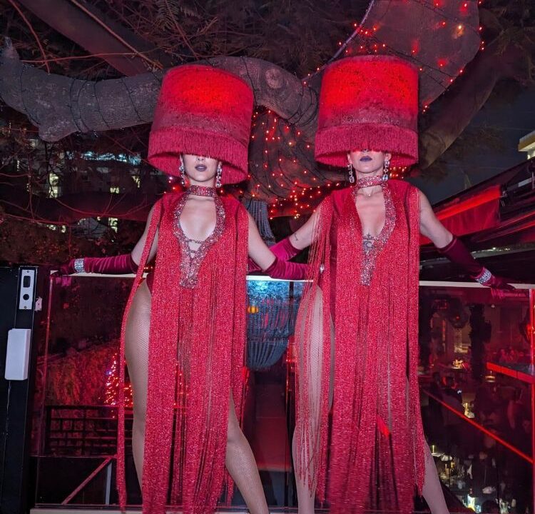 Professional event greeters welcoming guests at a Miami corporate event